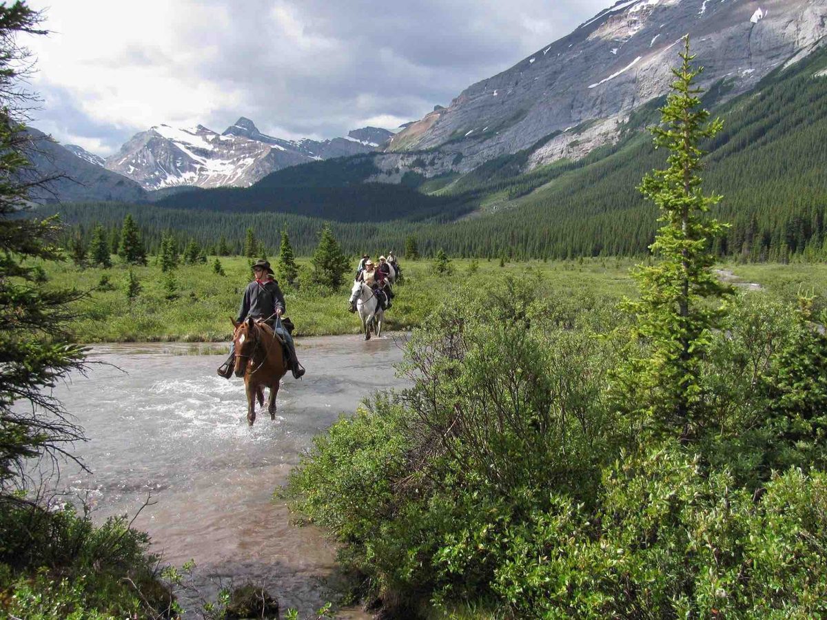 A rider on horseback in the foothills near Rock Lake