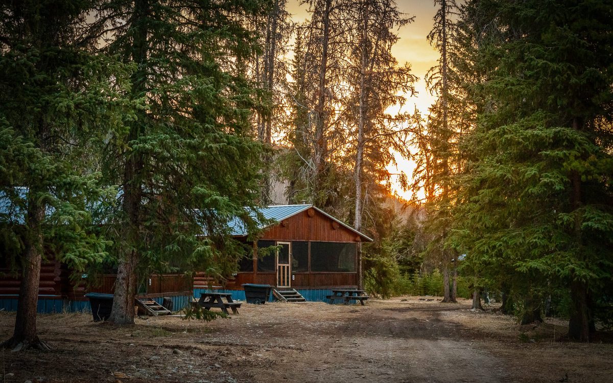 One of the four log cabins at Rock Lake Earth Lodge