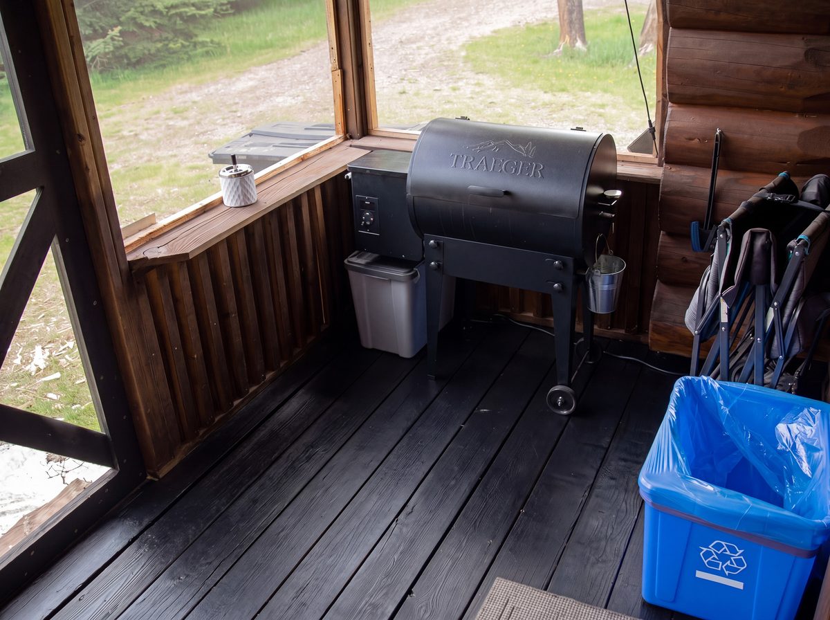 The screened cabin porch with a Traeger grill