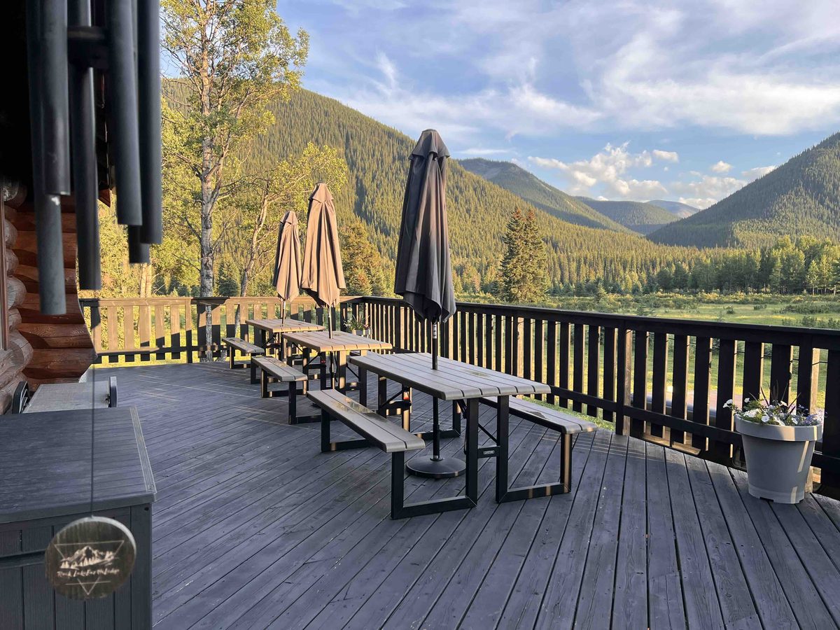 The wrap-around patio of the main lodge overlooking the valley