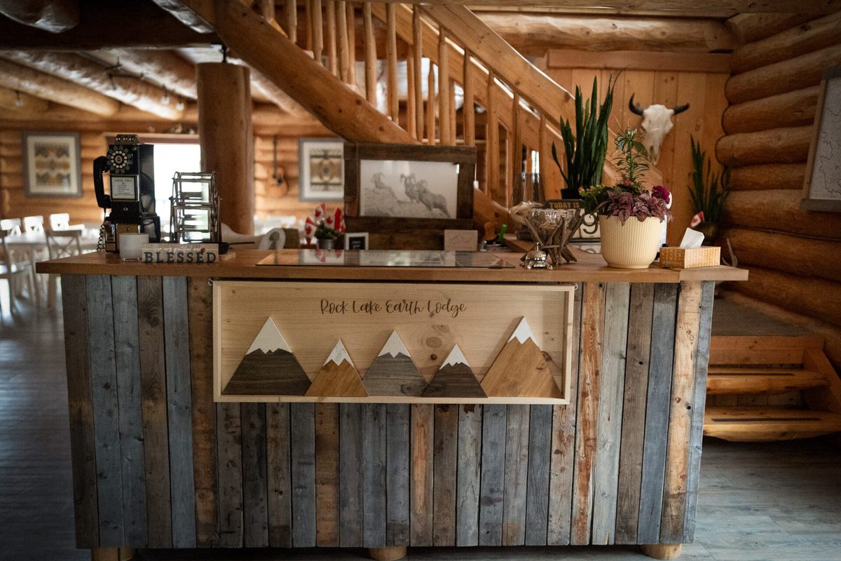 The hand-built front desk inside the main lodge