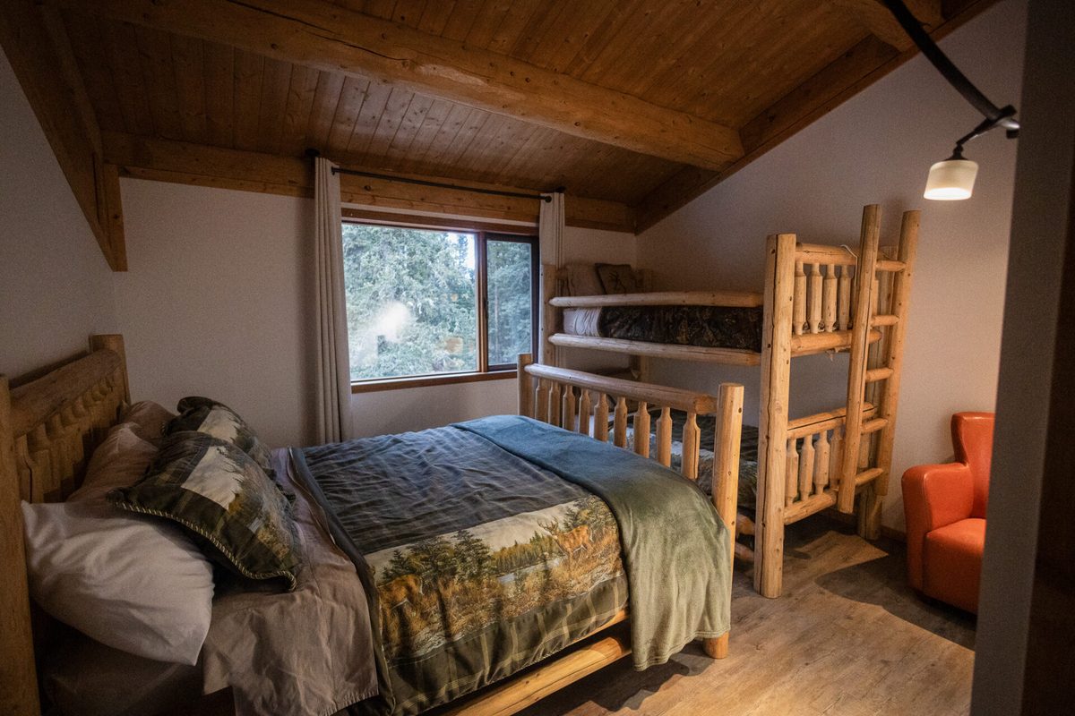 The Queen & Bunk suite with a plush queen bed