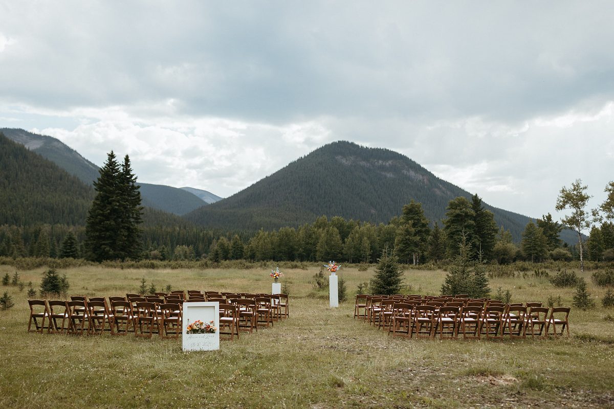 A couple at their Rock Lake ceremony with mountain views