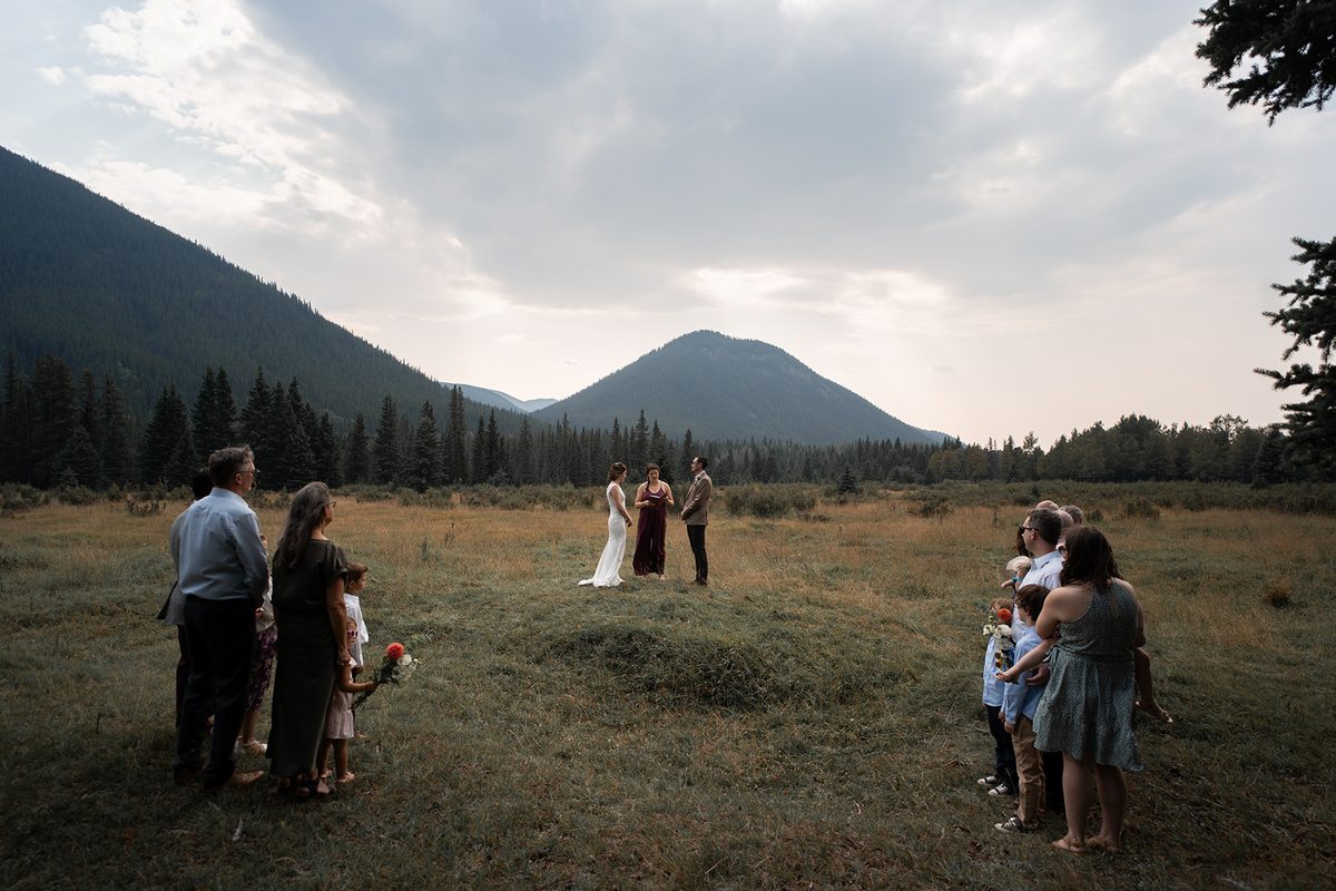 A couple exchanging vows in the mountains